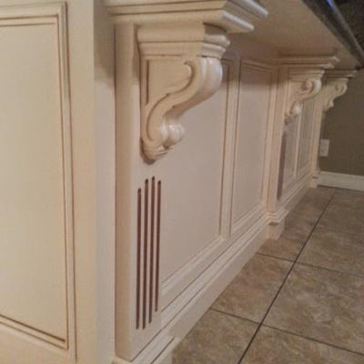 custom kitchen cabinets with corbels